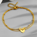 Tobillera de acero de titanio con letra inglesa de oro de 18k