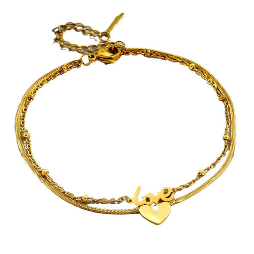 Tobillera de acero de titanio con letra inglesa de oro de 18k