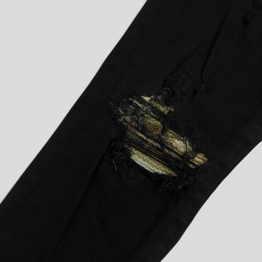 Amiri MX1 Aloha Patch Jeans en negro